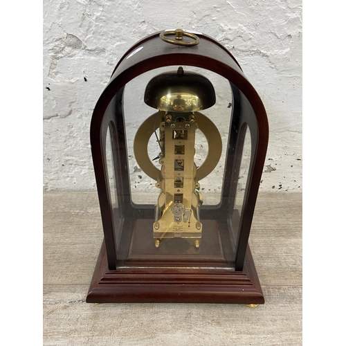 71 - A late 20th century German Hermle mahogany and brass cased key wind presentation mantel clock with k... 