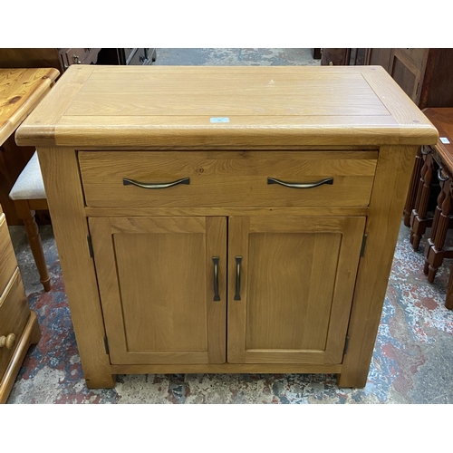 80 - A modern oak sideboard - approx. 86cm high x 85cm wide x 37cm deep