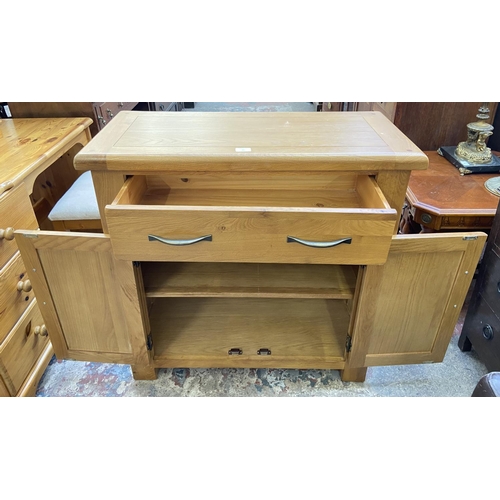 80 - A modern oak sideboard - approx. 86cm high x 85cm wide x 37cm deep