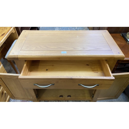 80 - A modern oak sideboard - approx. 86cm high x 85cm wide x 37cm deep