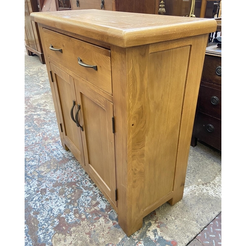 80 - A modern oak sideboard - approx. 86cm high x 85cm wide x 37cm deep
