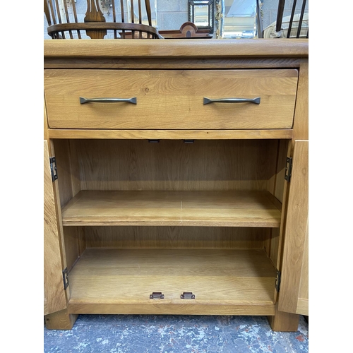 80 - A modern oak sideboard - approx. 86cm high x 85cm wide x 37cm deep