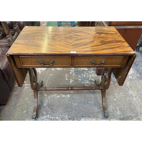 82 - A Regency style mahogany drop leaf lyre end sofa table - approx. 76cm high x 88cm wide not extended ... 