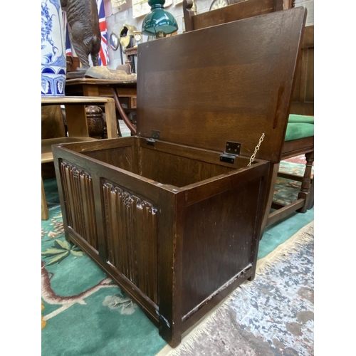 87 - A mid 20th century carved oak linenfold blanket box - approx. 46cm high x 76cm wide x 43cm deep