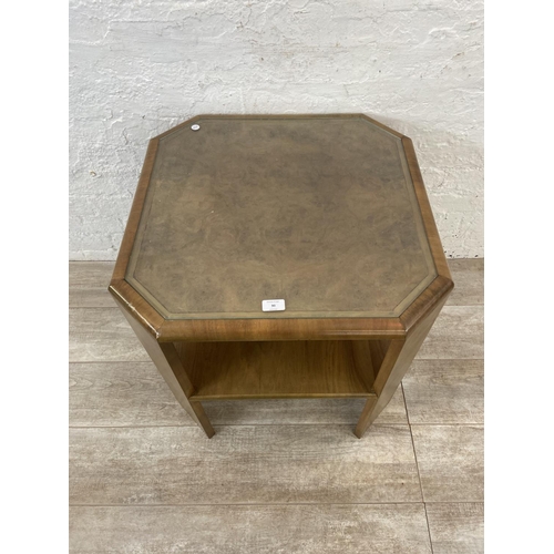 90 - An Art Deco walnut octagonal two tier occasional table - approx. 63cm high x 62cm wide x 62cm deep