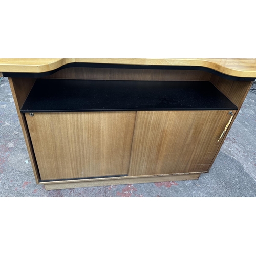 95 - A mid 20th century teak and beech drinks bar - approx. 108cm high x 153cm wide x 58cm deep
