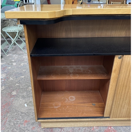 95 - A mid 20th century teak and beech drinks bar - approx. 108cm high x 153cm wide x 58cm deep