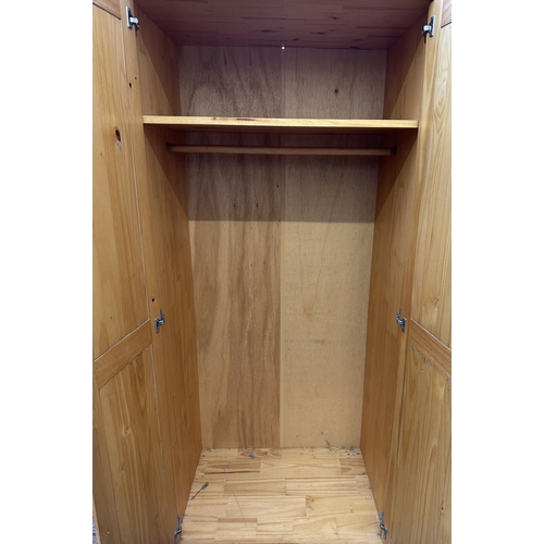 99 - A pine double wardrobe - approx. 178cm high x 82cm wide x 53cm deep