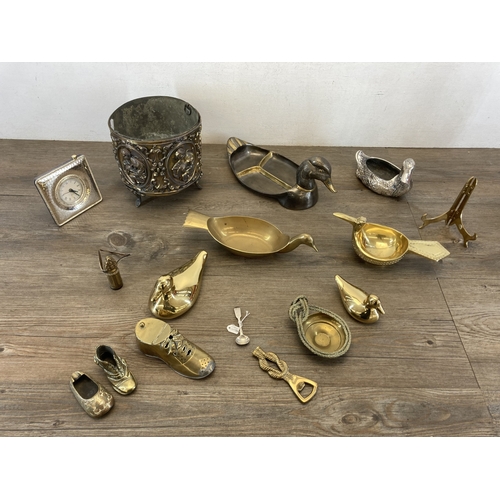 608 - A collection of metalware to include brass duck ornament, Rococo style embossed brass planter on tri... 