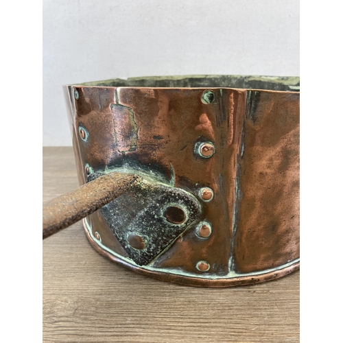 610 - A 19th century copper and brass saucepan - approx. 16cm high x 29cm diameter