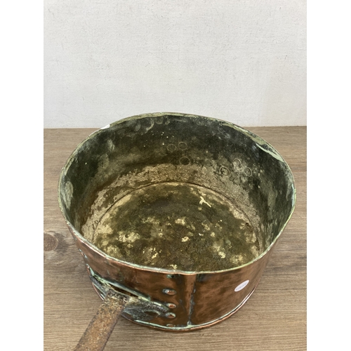 610 - A 19th century copper and brass saucepan - approx. 16cm high x 29cm diameter