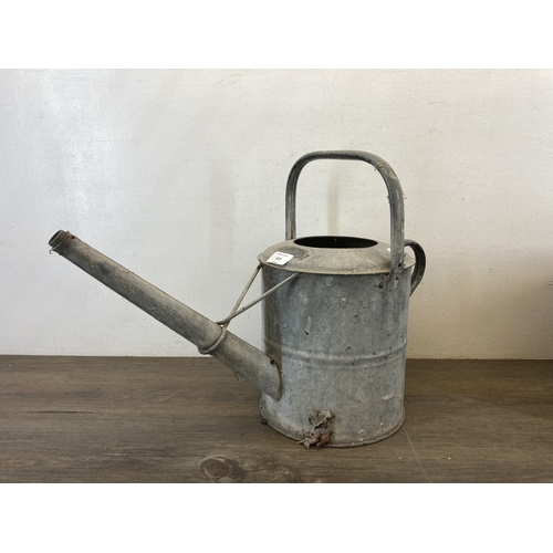 612 - Two mid 20th century galvanized items, one mop bucket and one watering can