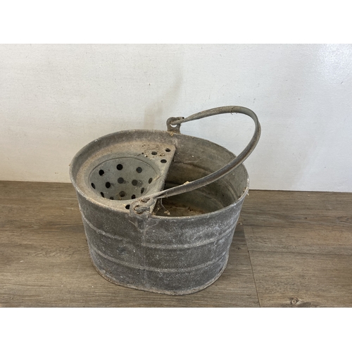 612 - Two mid 20th century galvanized items, one mop bucket and one watering can