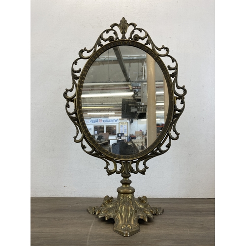 614 - A Rococo style brass tilting table mirror - approx. 50cm high