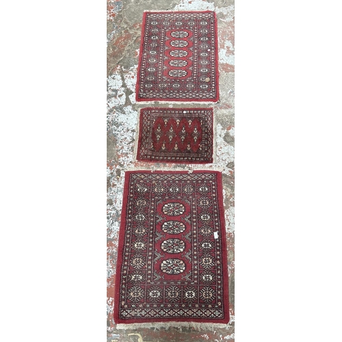 40A - Three mid 20th century Bokhara rugs - largest approx. 97cm x 65cm