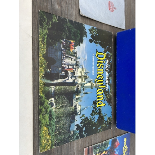 765 - A collection of Walt Disney's Disneyland souvenirs to include The Complete Guide to Walt Disney Worl... 