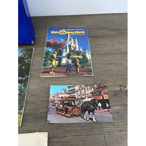 765 - A collection of Walt Disney's Disneyland souvenirs to include The Complete Guide to Walt Disney Worl... 