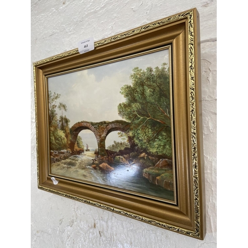 463 - A late 19th/early 20th century gilt framed oil on porcelain of a bridge and stream - approx. 28cm hi... 