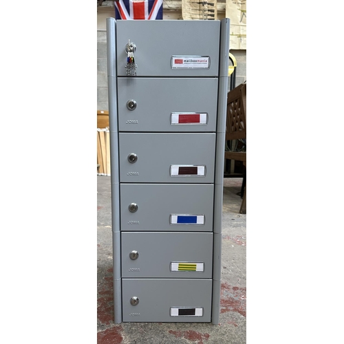 407 - A Joma grey metal six tier mailbox with two sets of keys - approx. 75cm high x 30cm wide x 37cm deep