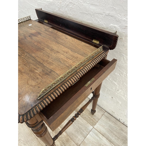 4 - An early/mid 19th century rosewood chamber table with brass galleried top and castors, stamped BS & ... 