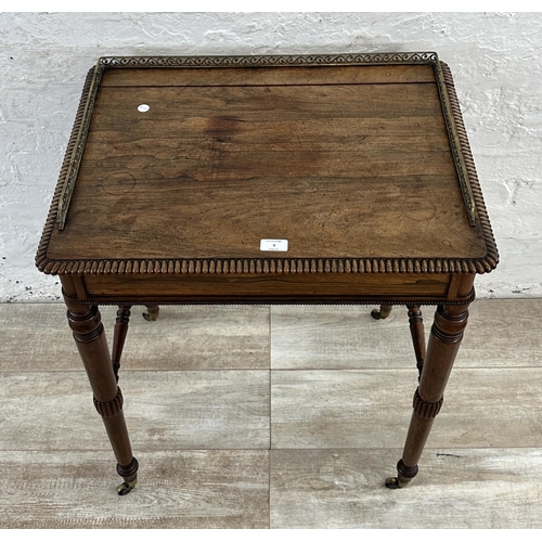 4 - An early/mid 19th century rosewood chamber table with brass galleried top and castors, stamped BS & ... 