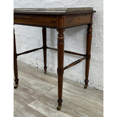 4 - An early/mid 19th century rosewood chamber table with brass galleried top and castors, stamped BS & ... 