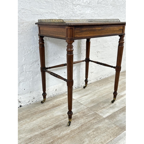4 - An early/mid 19th century rosewood chamber table with brass galleried top and castors, stamped BS & ... 