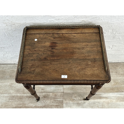 4 - An early/mid 19th century rosewood chamber table with brass galleried top and castors, stamped BS & ... 