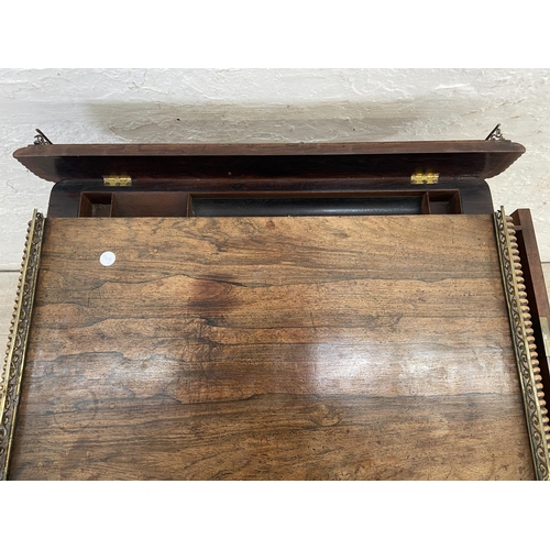 4 - An early/mid 19th century rosewood chamber table with brass galleried top and castors, stamped BS & ... 