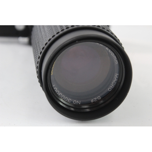 39 - A Minolta SR-T101 35mm SLR camera fitted with Bell & Howell 1:4.5 80-205mm macro zoom lens