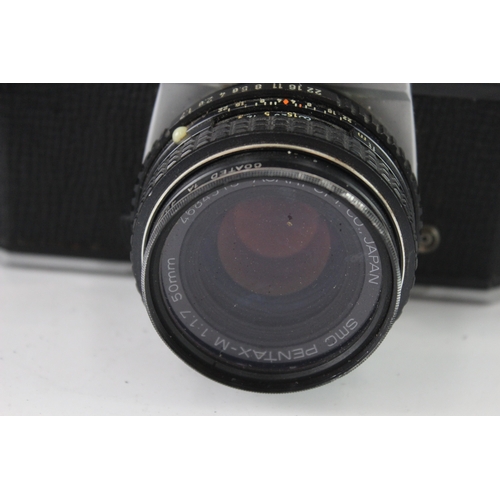9 - A cased Asahi Pentax K1000 35mm SLR camera fitted with Pentax-M 1:1.7 50mm lens