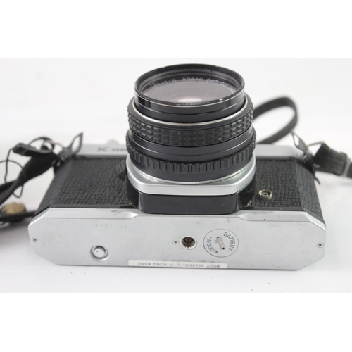 9 - A cased Asahi Pentax K1000 35mm SLR camera fitted with Pentax-M 1:1.7 50mm lens