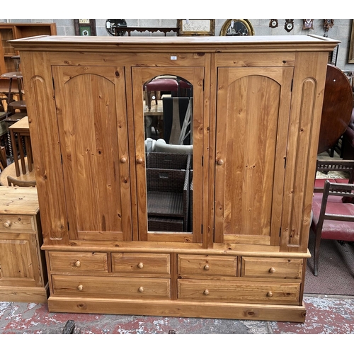 1122 - A modern pine mirrored triple wardrobe - approx. 211cm high x 206cm wide x 62cm deep