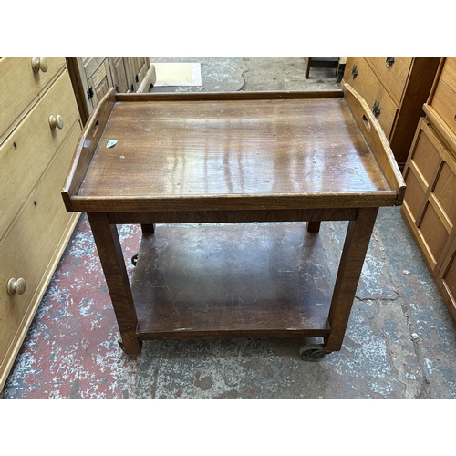 1143 - An Art Deco walnut two tier serving trolley with removable tray - approx. 74cm high x 54cm wide x 70... 
