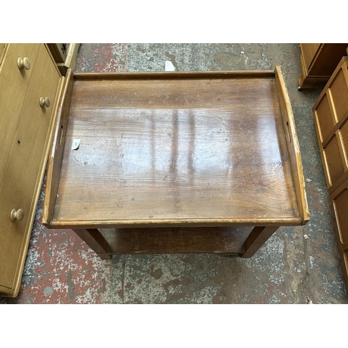 1143 - An Art Deco walnut two tier serving trolley with removable tray - approx. 74cm high x 54cm wide x 70... 