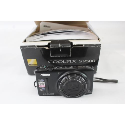 10 - A boxed Nikon Coolpix S9500 18mp BSI-CMOS sensor compact digital camera with cable, software disc an... 