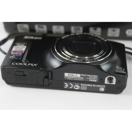 10 - A boxed Nikon Coolpix S9500 18mp BSI-CMOS sensor compact digital camera with cable, software disc an... 
