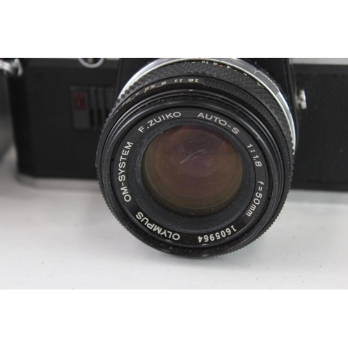 17 - A cased Olympus OM10 35mm SLR camera fitted with F.Zuiko Auto-S 1:1.8 50mm lens