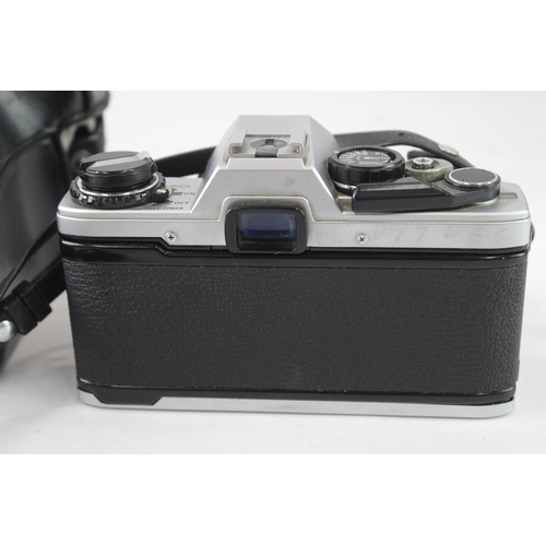 17 - A cased Olympus OM10 35mm SLR camera fitted with F.Zuiko Auto-S 1:1.8 50mm lens