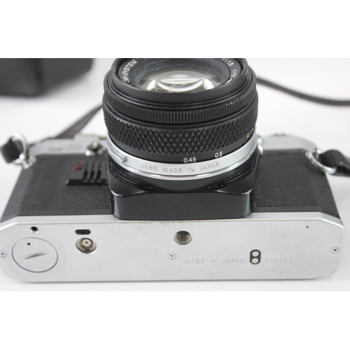17 - A cased Olympus OM10 35mm SLR camera fitted with F.Zuiko Auto-S 1:1.8 50mm lens
