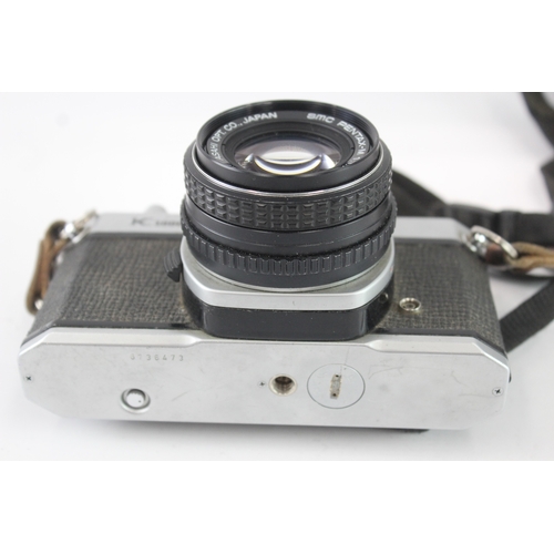 24 - An Asahi Pentax K1000 35mm SLR camera fitted with smc Pentax-M 1:1.7 50mm lens