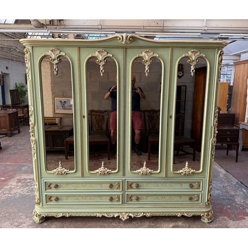 270 - A French Louis XV style green painted and gilded mirrored four door wardrobe - approx. 201cm high x ...