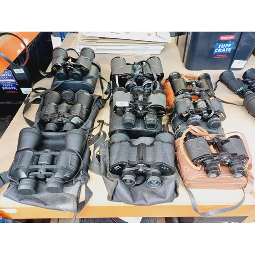 254 - Nine cased pairs of binoculars to include Greenkat, Chinon, Dollond etc.
