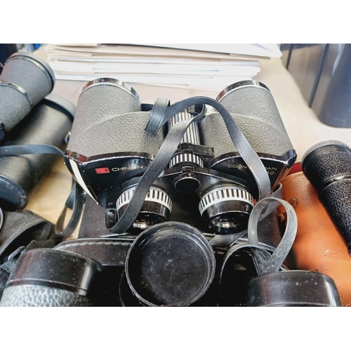 254 - Nine cased pairs of binoculars to include Greenkat, Chinon, Dollond etc.