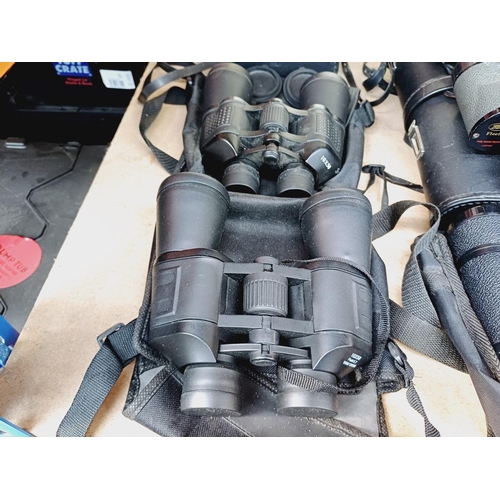 254 - Nine cased pairs of binoculars to include Greenkat, Chinon, Dollond etc.