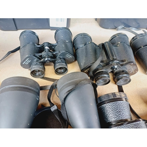 255 - Nine pairs of binoculars to include Miranda, Super Zenith, Tasco etc.