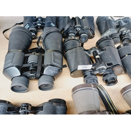 255 - Nine pairs of binoculars to include Miranda, Super Zenith, Tasco etc.