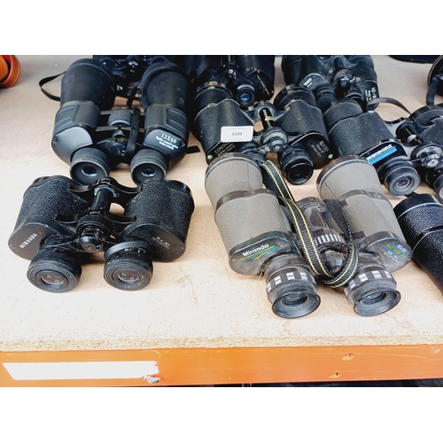255 - Nine pairs of binoculars to include Miranda, Super Zenith, Tasco etc.