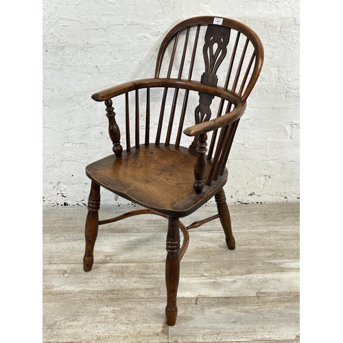 1002 - A 19th century yew wood and elm Windsor chair, stamped E. Gabbitass Worksop - approx. 88cm high x 47... 