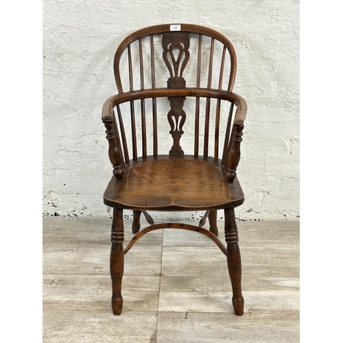 1002 - A 19th century yew wood and elm Windsor chair, stamped E. Gabbitass Worksop - approx. 88cm high x 47... 